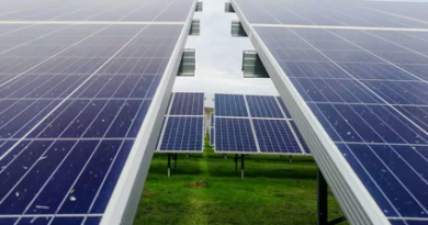 Solar panels installed on a vast field, harnessing sunlight for renewable energy generation.